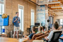 An illustrative photo of a man presenting to others