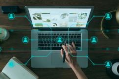An illustrative photo of a person working on a laptop.