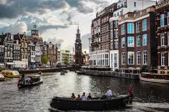 An illustrative photo of a canal scene in Amsterdam.