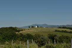 An illustrative photo of a hill with a house