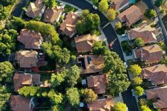 An illustrative photo of solar panels on roofs.