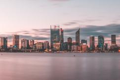 An illustrative photo of a city near body of water during daytime