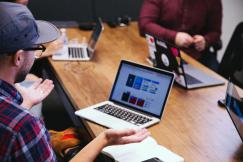 An illustrative photo of a man talking in the online meeting