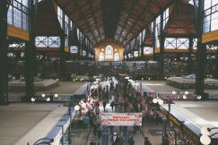 An illustrative photo of a large room with people in it.