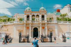 An illustrative photo of a building with a gate.