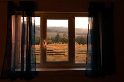 An illustrative photo of white wooden framed glass window