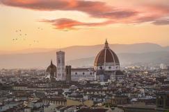An illustrative photo of s a city bathed in the warm hues of sunset