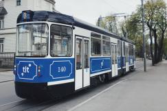 An illustrative photo of a white and blue train.