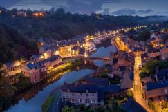 An illustrative photo of a river town at night