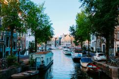 An illustrative photo of a scenery of old city situated on calm channel.