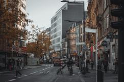 An illustrative photo of people walking on the street.