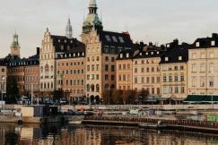 An illustrative photo of tenements by a river in Stockholm