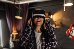 An illustrative photo of a woman wearing a vr headset.