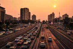An illustrative photo of vehicle in road at golden hour.