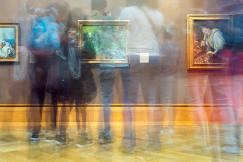 An illustrative photo of reflections of people on glass