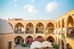 An illustrative photo of a courtyard surrounded by an arched gallery