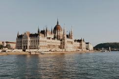 An illustrative photo of a building beside body of water.