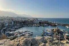 An illustrative photo of a coastal marina with numerous boats in Cyprus