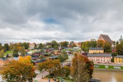 An illustrative photo of a town with colorful houses.