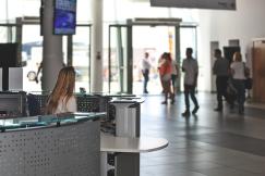 An illustrative photo of a woman sitting at a reception desk