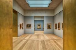An illustrative photo of a room decorated with paintings on the walls