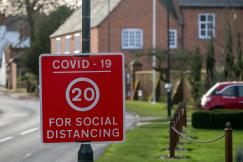 An illustrative photo of a red and white stop road sign
