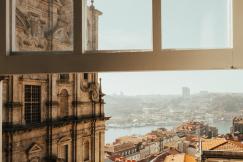 An illustrative photo of an opened window with a view on the city