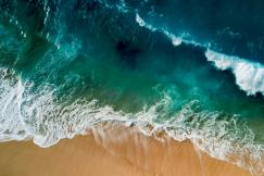 An illustrative photo of ocean waves on the shore