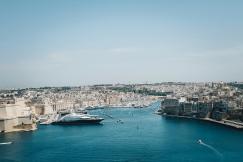 An illustrative photo of a city next to a body of water.