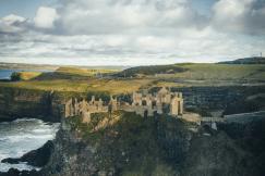 An illustrative photo of a castle on cliff near lake
