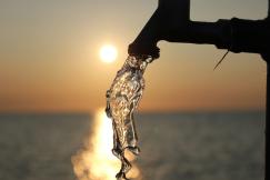An illustrative photo of a sunset reflecting off water.
