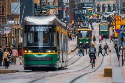 An illustrative photo of a green and yellow city tram.