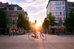 An illustrative photo of a man riding bicycle on road in Belgium