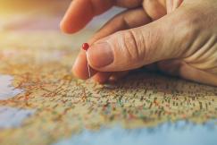 An illustrative photo of a hand with a map