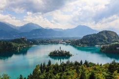 An illustrative photo of a building nestled on an island, surrounded by the tranquil waters of Lake Bled in Slovenia.