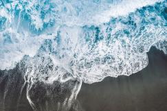 An illustrative photo of ocean waves on the beach