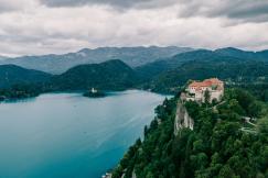 An illustrative photo of a body of water surrounded by mountains.