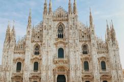 An illustrative photo of a crowd of people in front of the Milan Cathedral