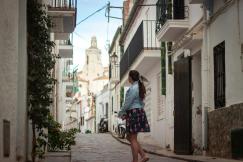 An illustrative photo of a person walking down a street.
