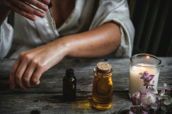 An illustrative photo of a person’s forearm being treated with a dropper bottle.