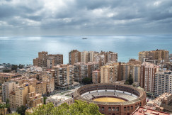 An illustrative photo of a view of a city with tall buildings near a body of water