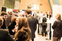 An illustrative photo of a group of individuals at a social or networking event