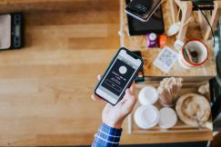 An illustrative photo of a person using a smartphone
