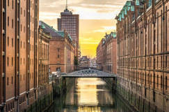 An illustrative photo of a channel between tall buildings in Hamburg