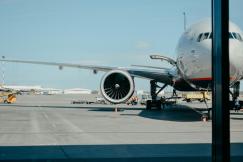 An illustrative photo of white airliner on runway
