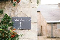 An illustrative photo of hotel and restaurant signage.