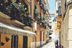 An illustrative photo of a narrow street in Spain