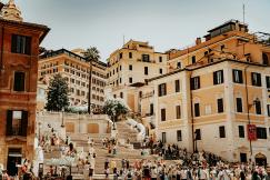 An illustrative photo of people walking on Spanish steps