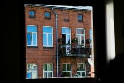 An illustrative photo of a brick building with windows