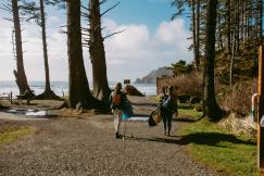 An illustrative photo of a couple of people walking down a dirt road